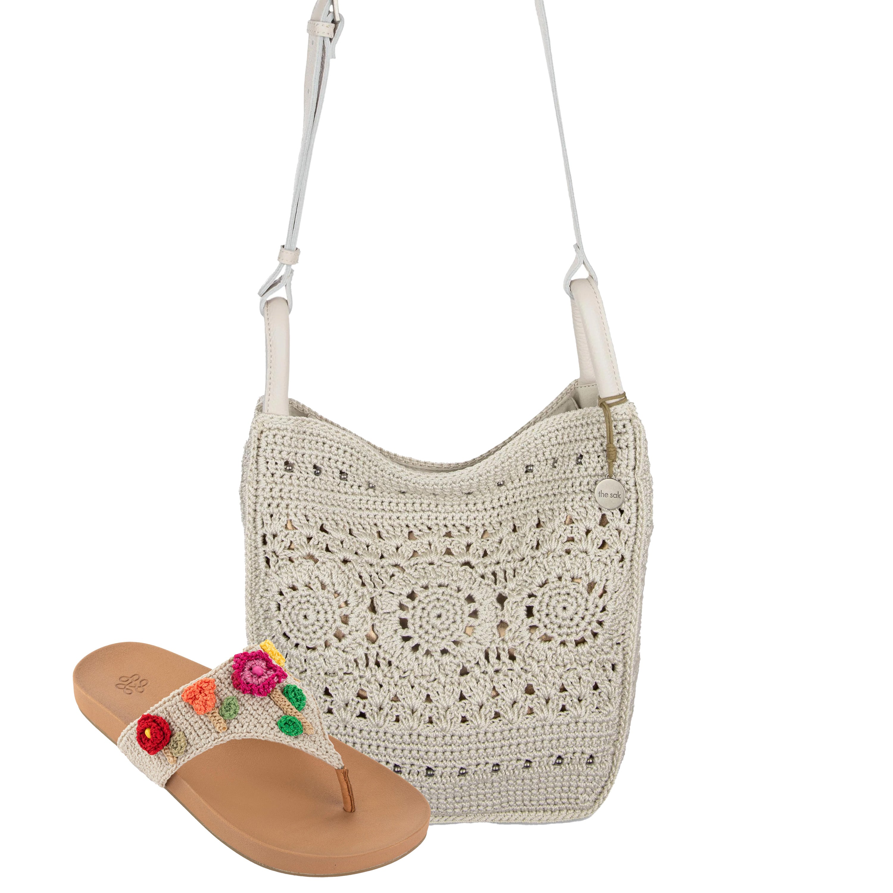 Cream crochet crossbody bag with adjustable strap and tan sandal with colorful floral beaded details.