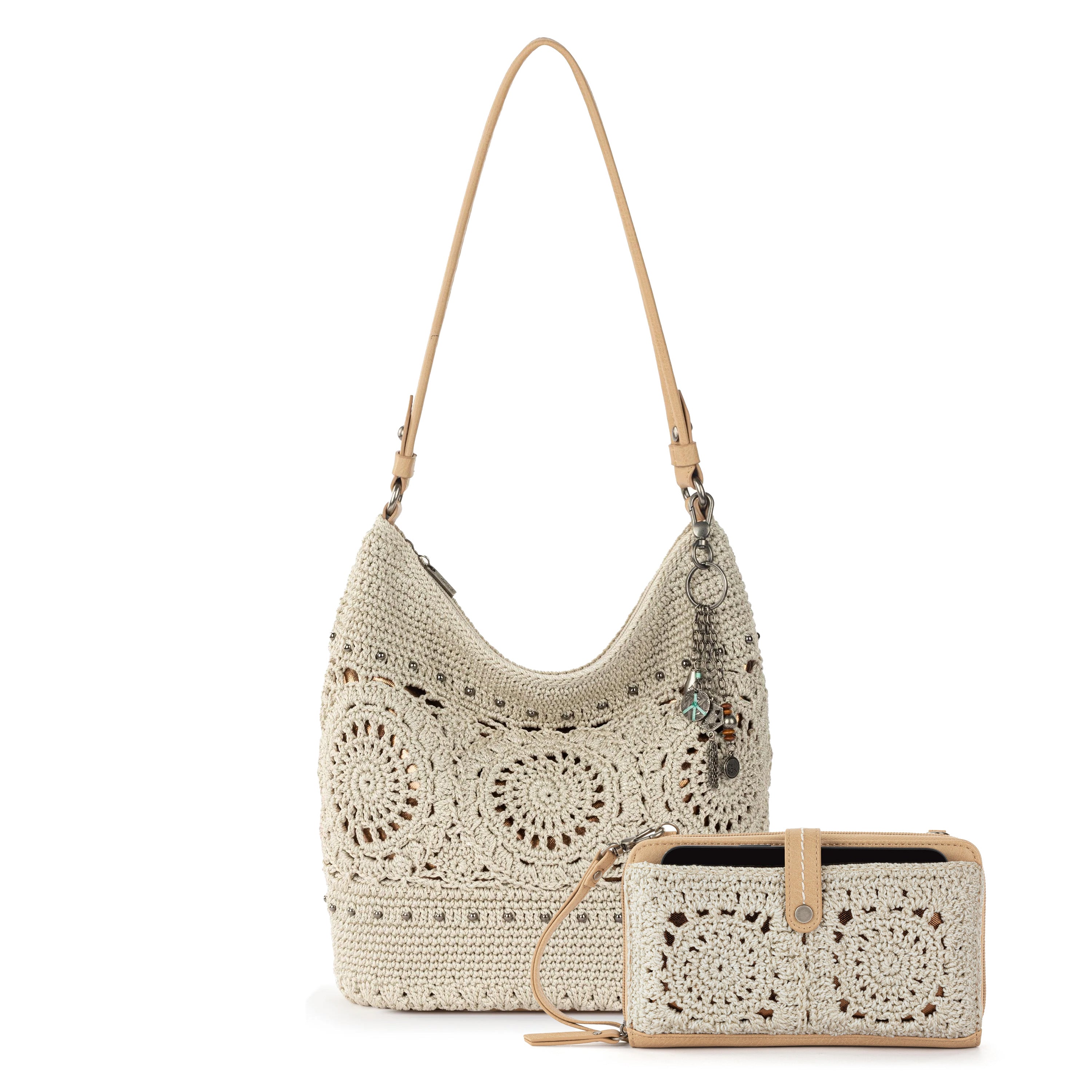 Cream crochet hobo bag with tan leather straps and matching crochet smartphone wallet with tan trim.