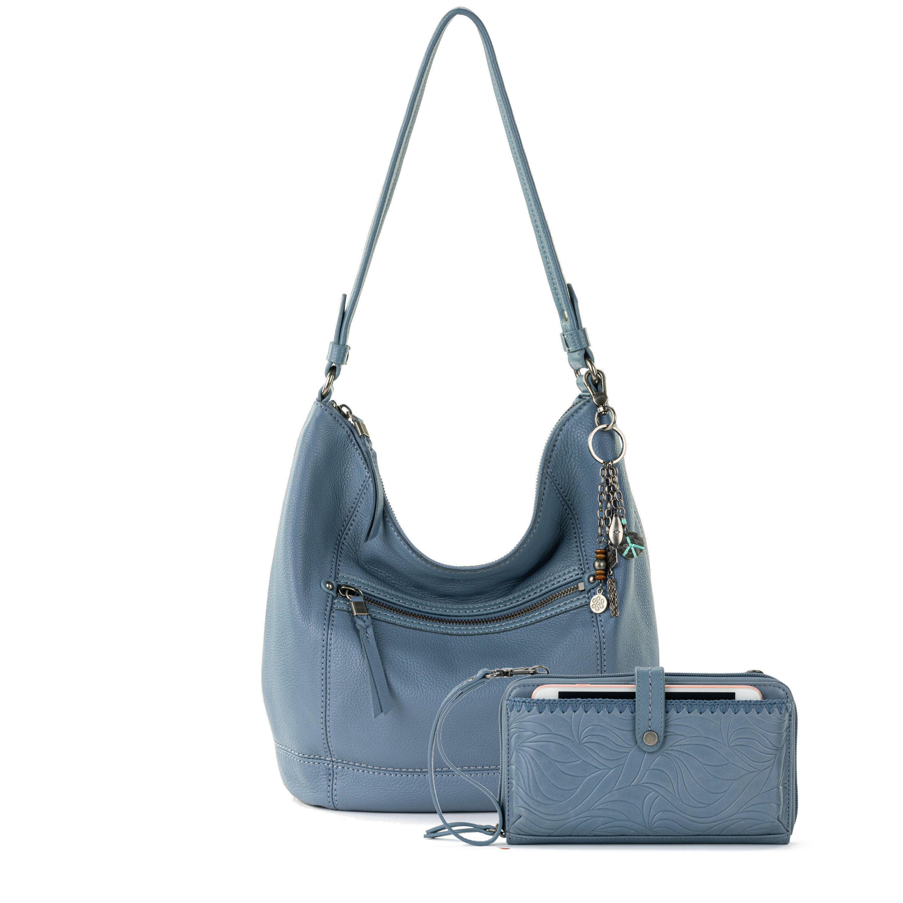 Blue leather hobo bag with single shoulder strap and matching embossed smartphone wallet with zipper closure.